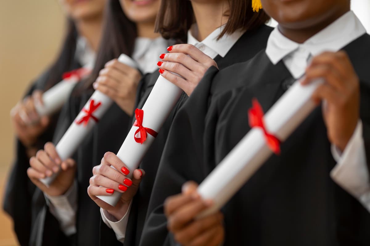 Graduates holding diplomas - achieve your dream college admission